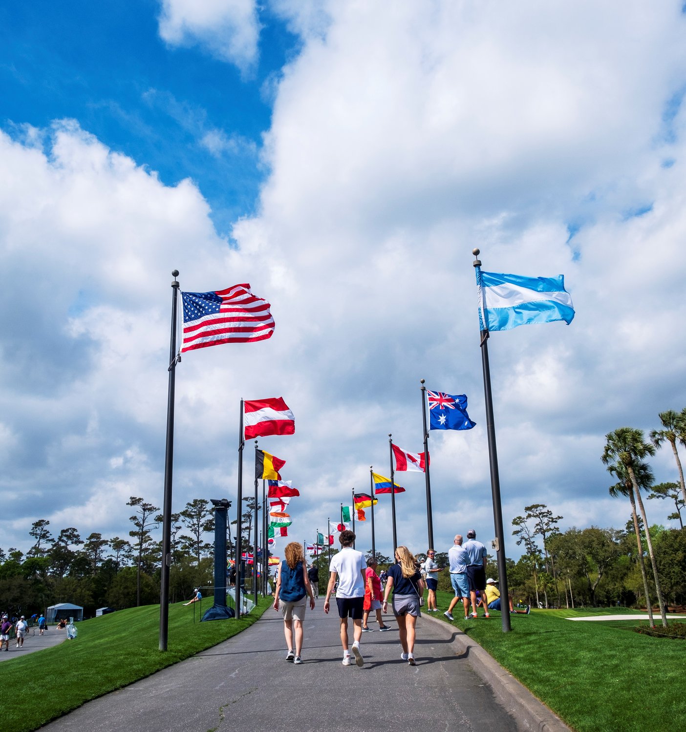 Fans walk across the grounds at TPC Sawgrass on Wednesday, March 9, during THE PLAYERS Championship.