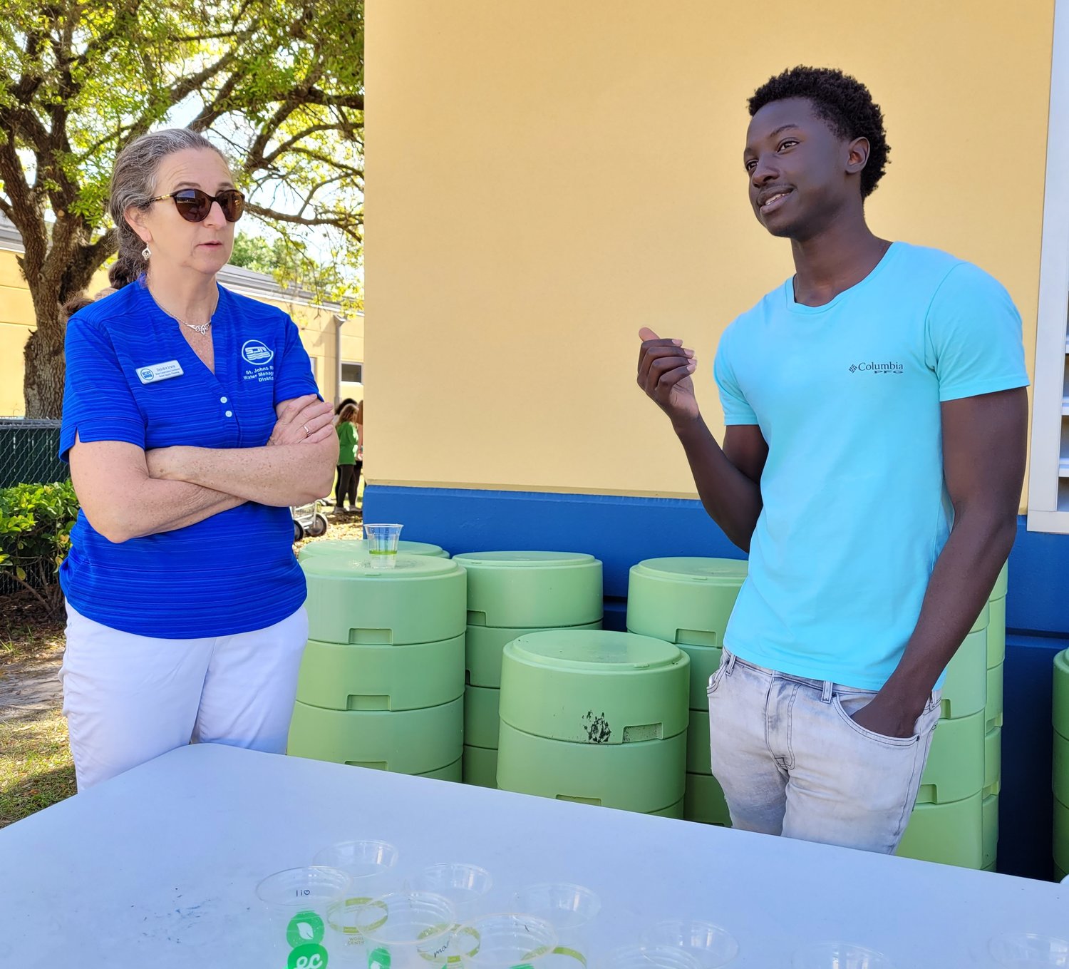 Deirdre Irwin, St. Johns River Water Management District water conservation coordinator, talks with a Creekside High School student.