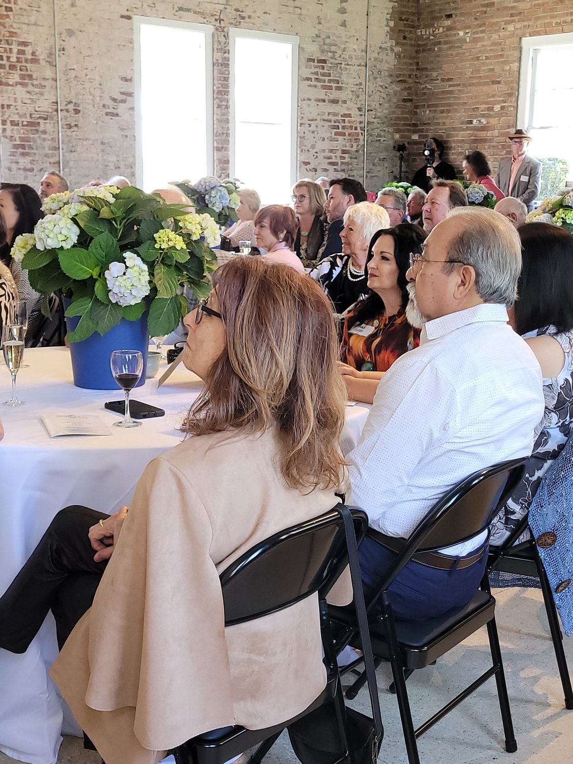 St. Johns Cultural Council ROWITA awards event recipients and attendees are seated round a table at The Waterworks.