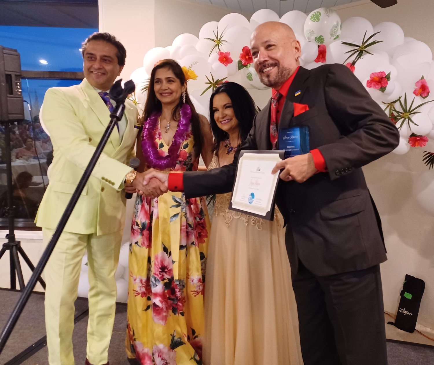 Dr. Arun Gulani, left, congratulates Jorge Rivera on winning the Chairman’s Award at Beaches, A Celebration of the Arts on Sunday, May 15. Also pictured are co-chair Dr. Suparna Gulani, center left, and First Coast Cultural Center Executive Director Donna Guzzo.