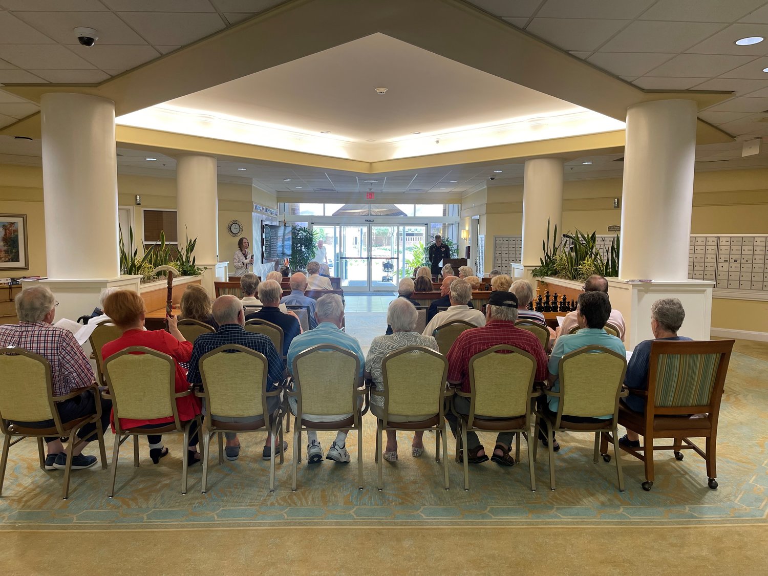 Residents of Cypress Village listen to Veterans Committee chair Jim Jandreau.
