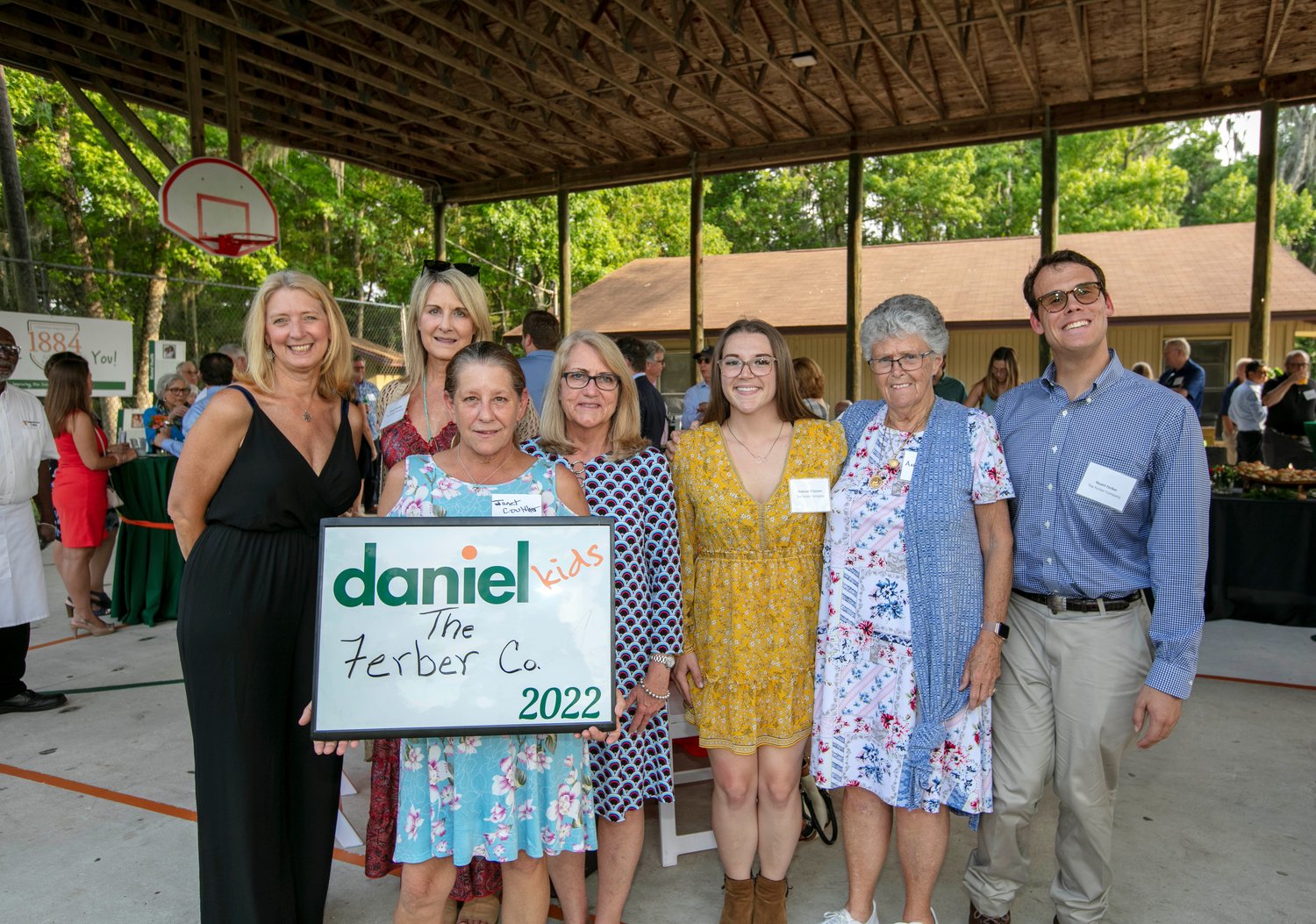 Angi Palmieri, Stacey Starsiak, Janet Coulther, Mindy Sigle, ShiAnne O’Connor, Annie Cuneo and Stuart Ferber, all representing The Ferber Company, gather for a photo during the recent 1884 Giving Society event, which benefits Daniel.
