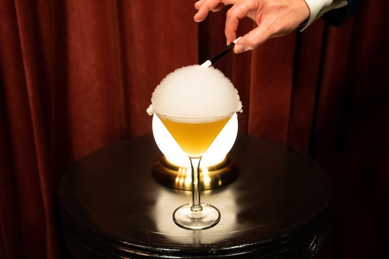 The Magic Word, a special beverage served prior to the show, is transformed after being touched with a magic wand.