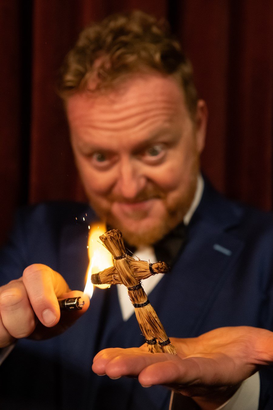 Magician Bill Abbott burns an effigy of an audience volunteer with surprising results.
