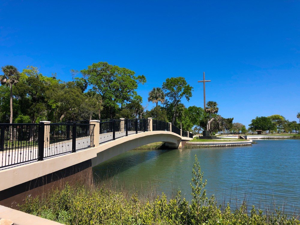 A foot bridge over the lagoon leads to the mission proper.