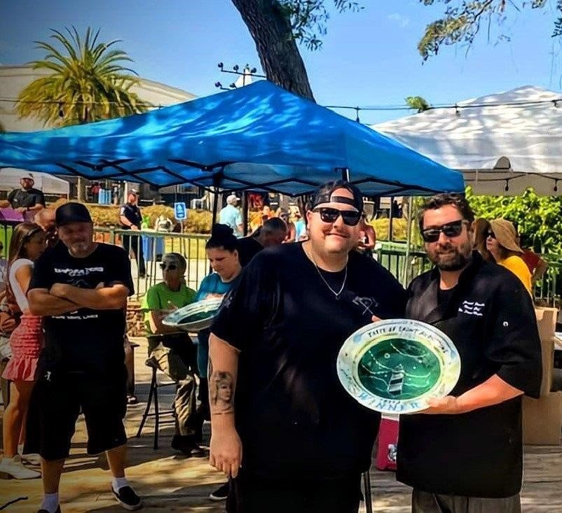 Chef Freddy Underhill won the Grand Prize for Best Upscale Dish at the 2022 Taste of St. Augustine: Pancetta Candita atop Plantain Pancake with Smoked Tomato Aioli, Grilled Pineapple and Citrus Gremolata.
