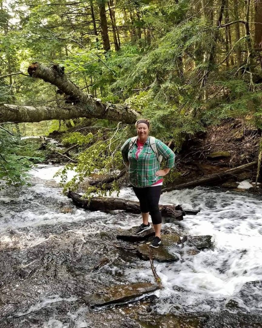 Sarah Stecker, CEO and founder of Travel Advisors Unlimited, is seen on a hiking trip in Canada, where she followed waterfall trails and camped under the stars.