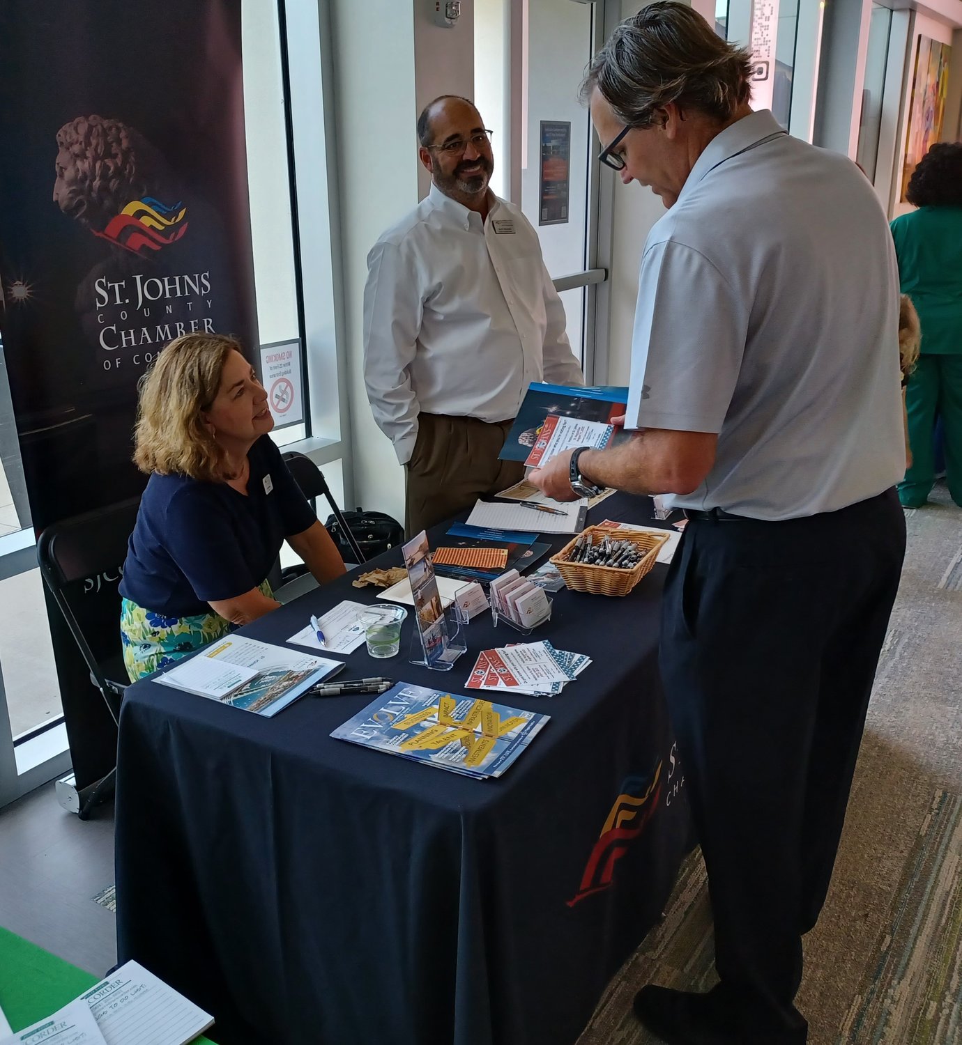 Karen Everett, director of the Ponte Vedra Beach Division of the St. Johns County Chamber of Commerce, and Scott Maynard, director of economic development for the Chamber, meet with members of the public during the link’s Business Expo on Friday, July 15.