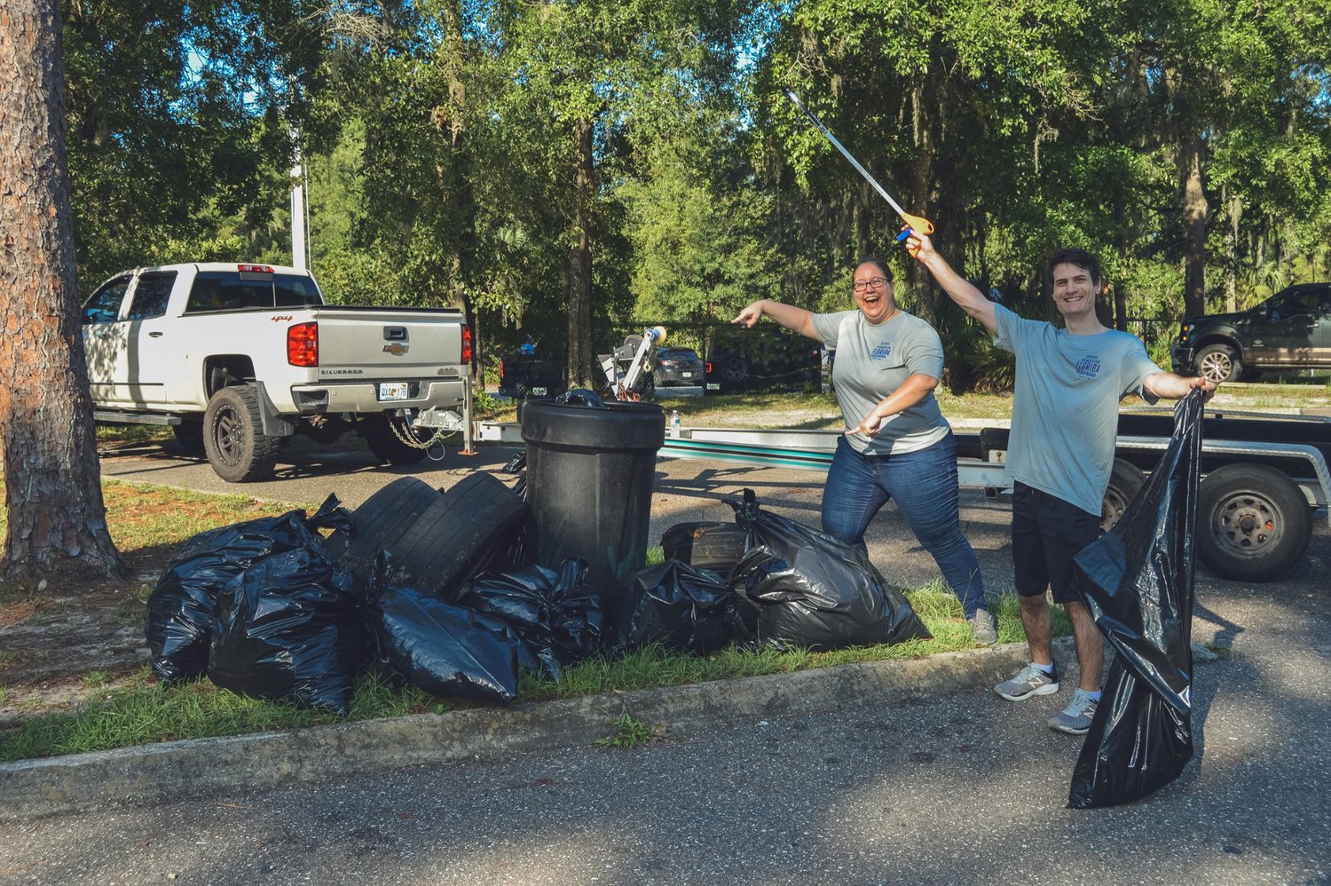 Volunteers at the Wayne Stevens Boat Ramp were happy to show off their successful efforts.
