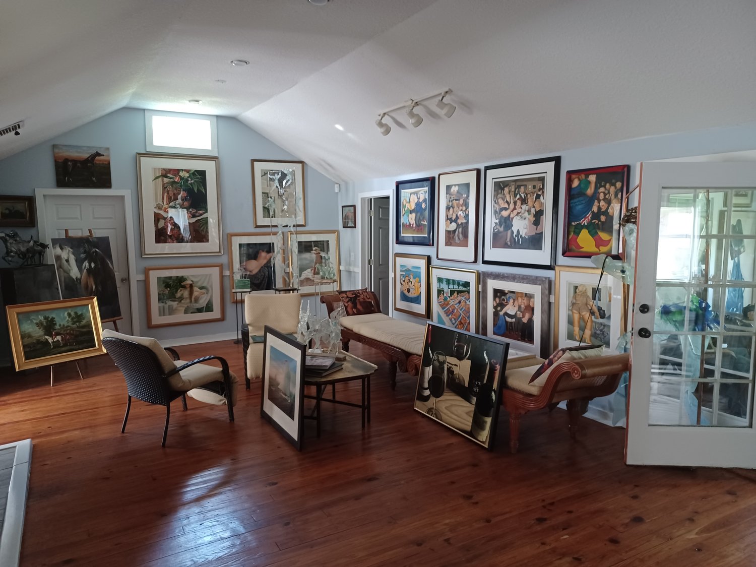 What J. Norman Henry does not have is empty wall space. Here are some of the many pieces he recently transported from his warehouse in New Jersey.