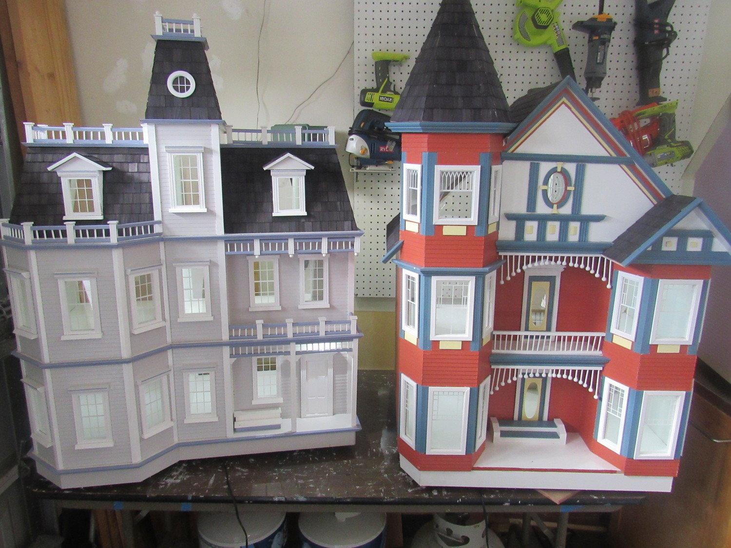 Two of the elaborate dollhouses created by Brendan Hoffman for children in the Community PedsCare program.