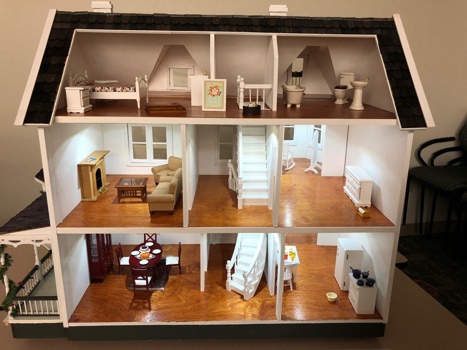 The interiors of Brendan Hoffman’s dollhouses are elaborately furnished and lighted.