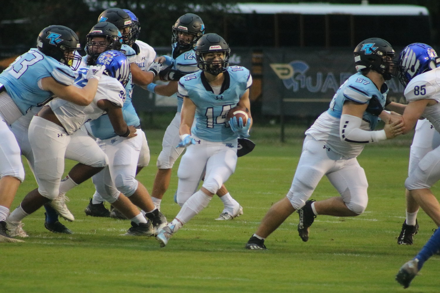 Griffin Owen runs through a massive hole created by his offensive line.