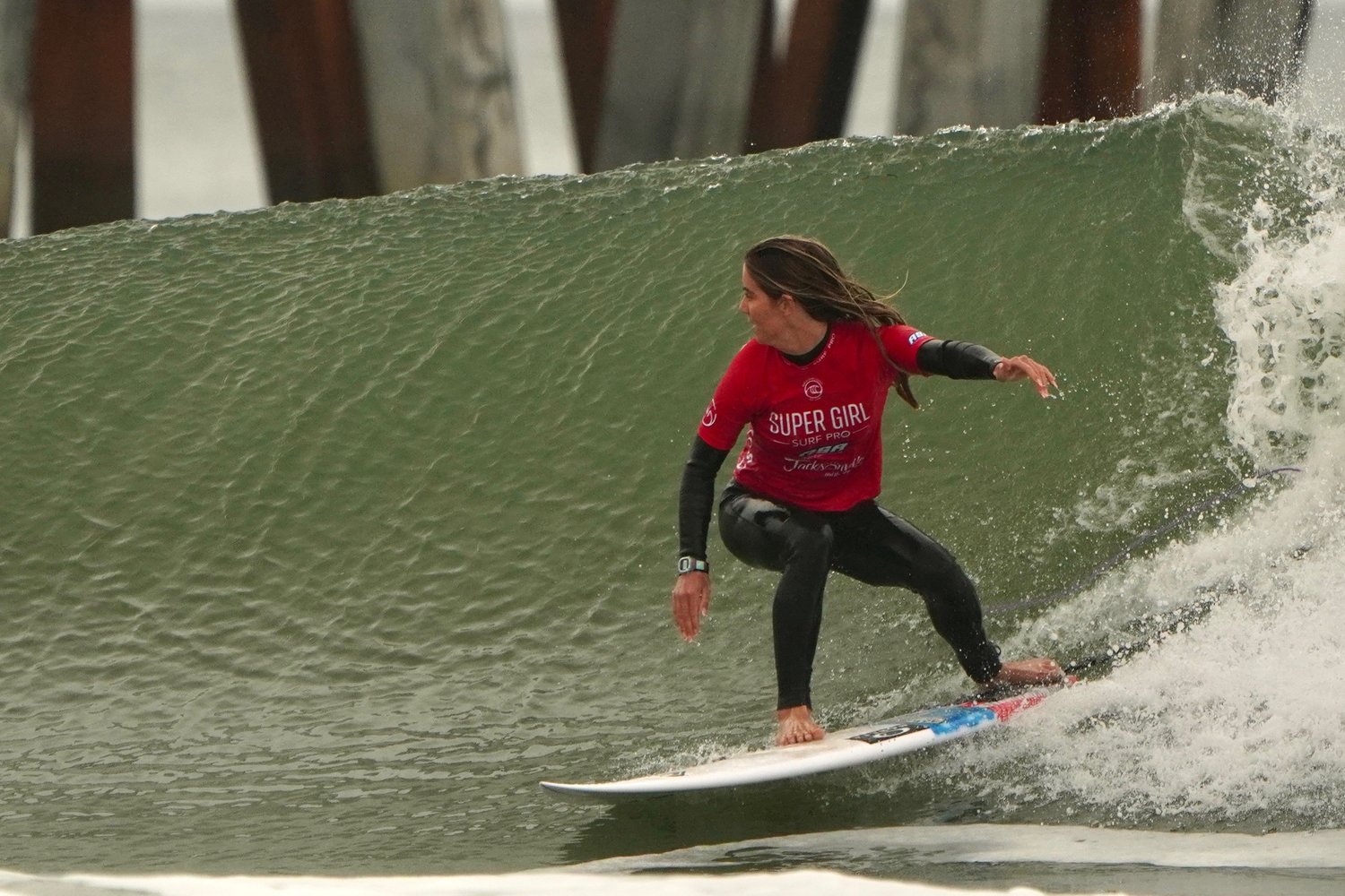 Former Super Girl champions Caroline Marks rides a wave in Jacksonville Beach during 2021’s competition.