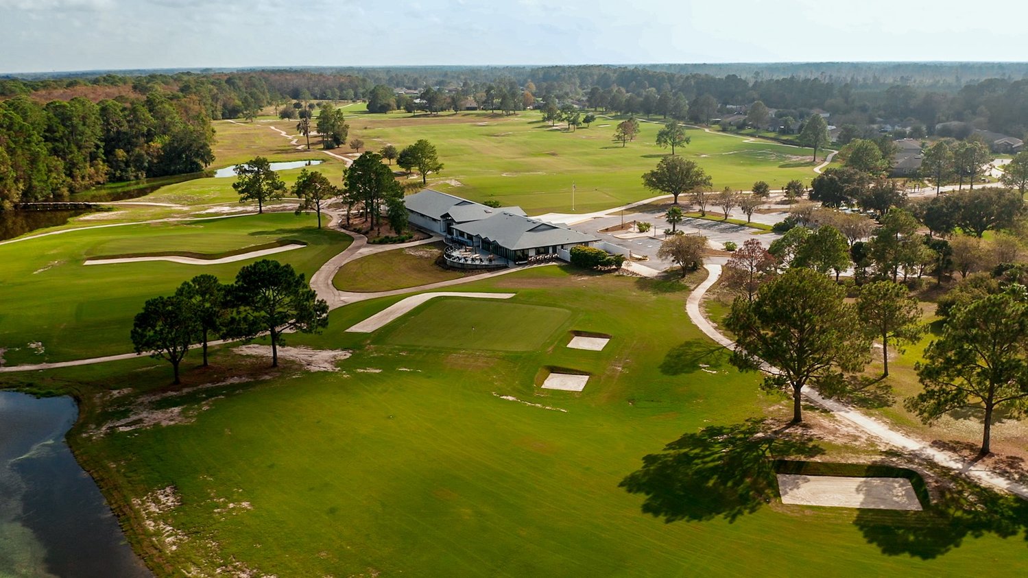 Aerial of holes (foreground, to back left) 18, 10 and 9 and the clubhouse, practice facility and short-game area.