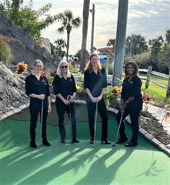 Members of the Palencia Dental team are seen at Wildflower Healthcare’s miniature golf fundraiser.