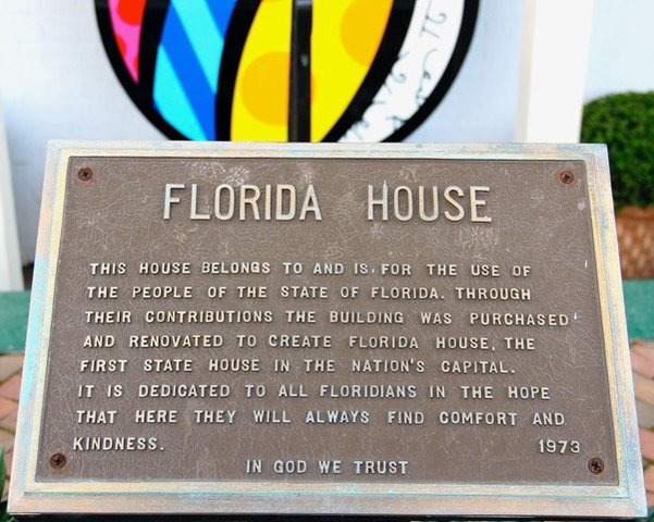 A bronze sign stands outside Florida House.