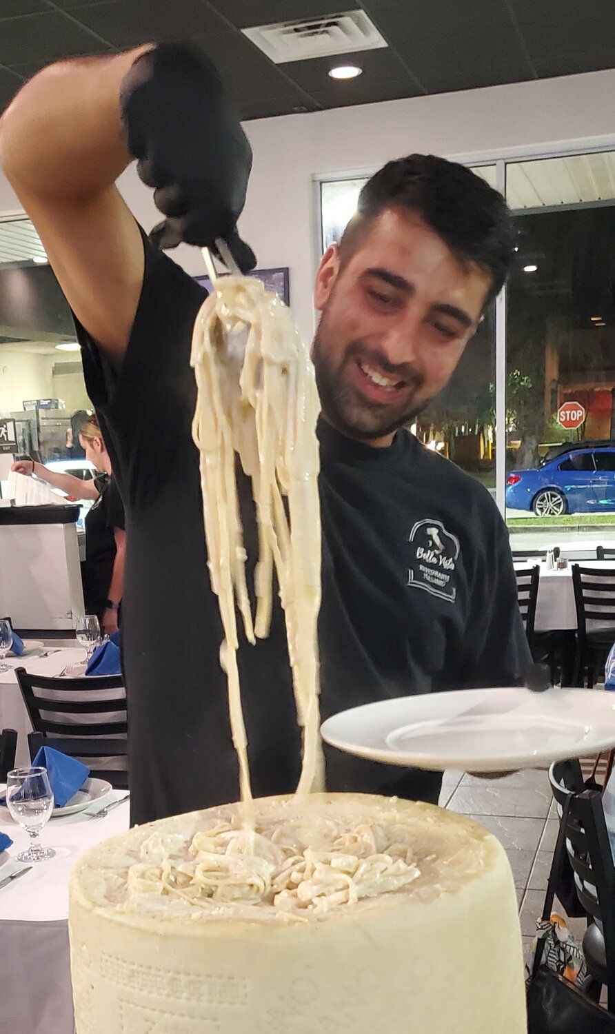 Giovanni Prignano dishes out a pasta entre.
