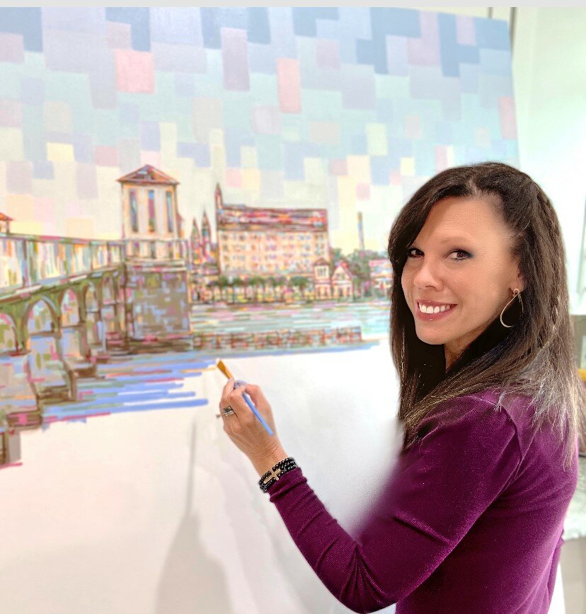 Linda Sperruzzi works on a painting of the Bridge of Lions.
