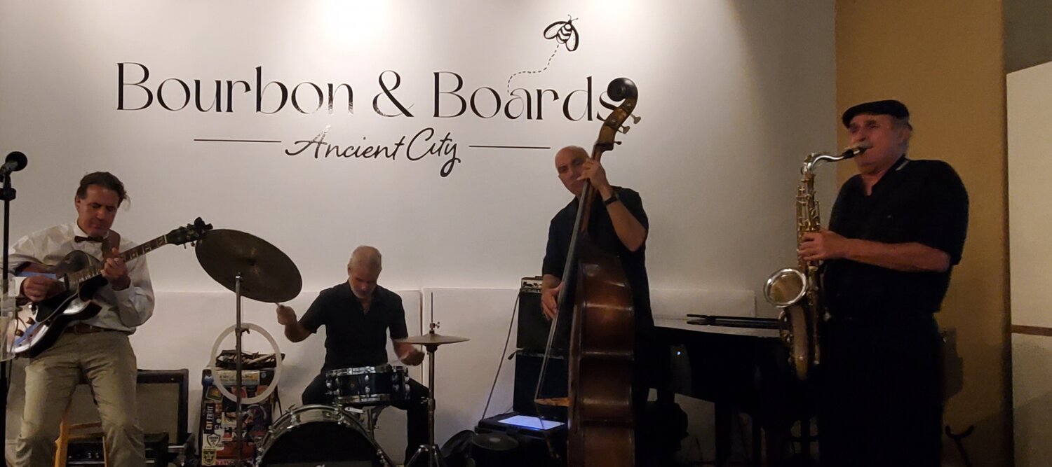 Musicians perform at Bourbon & Boards