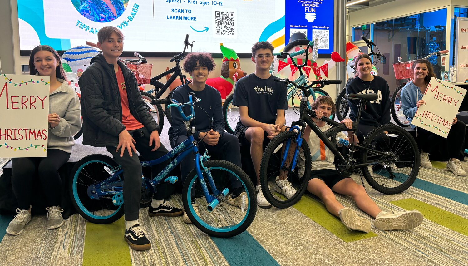 Members of the link Teen Club recently gathered to build bikes for deserving kids.